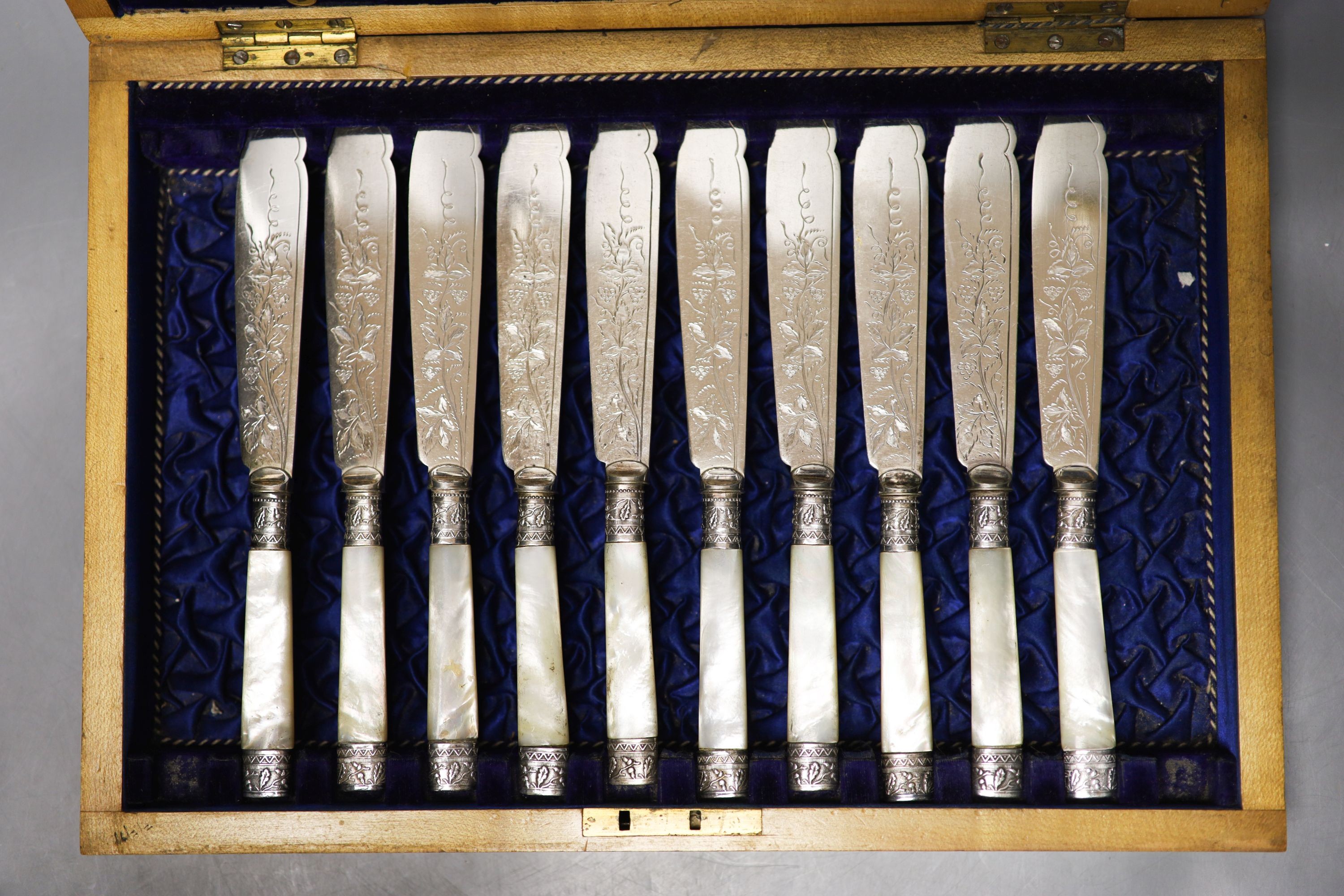 A George V cased set of six pairs of mother of pearl handled silver dessert eaters, Sheffield, 1912 and a plated part set.